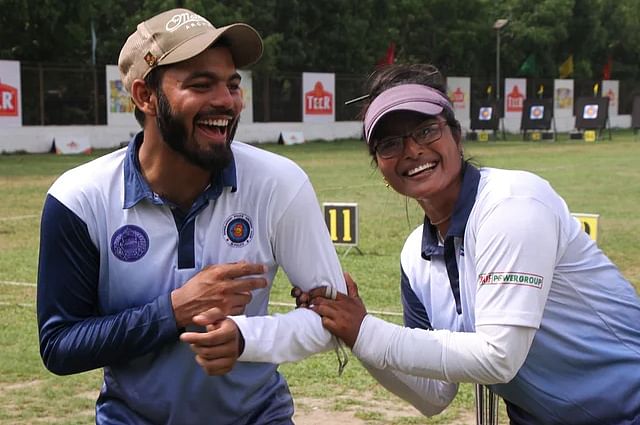 Ashikuzzaman and Shamoly Roy celebrate after winning gold