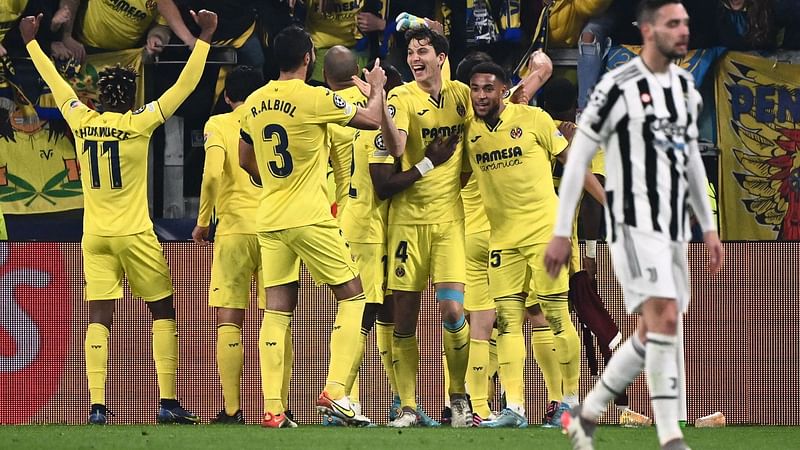 Villarreal's Spanish defender Pau Torres (Rear C) celebrates after scoring during the UEFA Champions League round of 16 second leg football match between Juventus and Villareal on 16 March, 2022