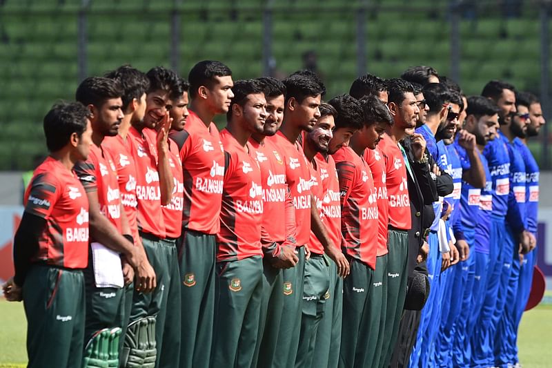 Bangladesh's (L) and Afghanistan's players before the start of the second Twenty20 international cricket match between Bangladesh and Afghanistan at the Sher-e-Bangla National Cricket Stadium in Dhaka on 5 March  2022.