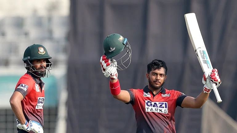 Rupganj Tigers Cricket Club's opener Zakir Hasan celebrates after completing his century during a DPL match against Abahani Limited on 15 March, 2022