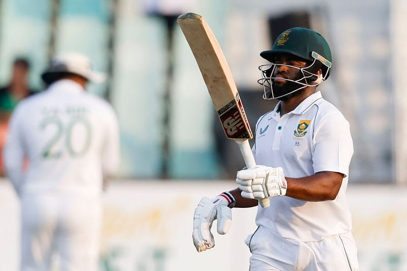 South Africa's Temba Bavuma celebrates after scoring a half-century (50 runs) during the first day of the first Test cricket match between South Africa and Bangladesh at the Kingsmead stadium in Durban on 31 March 2022.