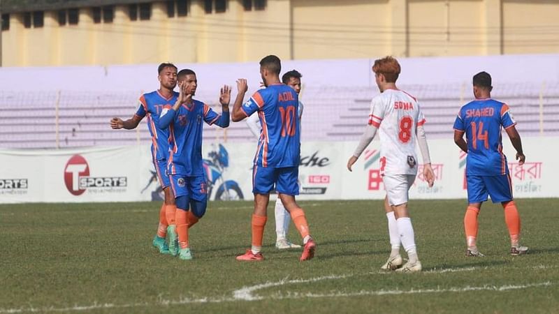 Bangladesh Police Football Club's Moroccan midfielder Adil Kouskous celebrates after scoring a goal during the BPL Football match against Muktijoddha Sangsad Krira Chakra on 2 March, 2022