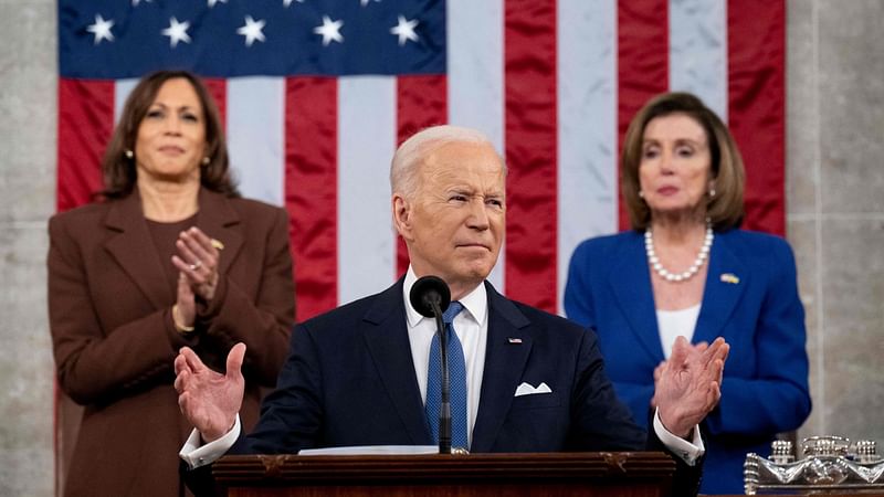 US Vice President Kamala Harris (L) and US House Speaker Nancy Pelosi (D-CA) applaud US President Joe Biden as he delivers his first State of the Union address at the US Capitol in Washington, DC, on 1 March, 2022