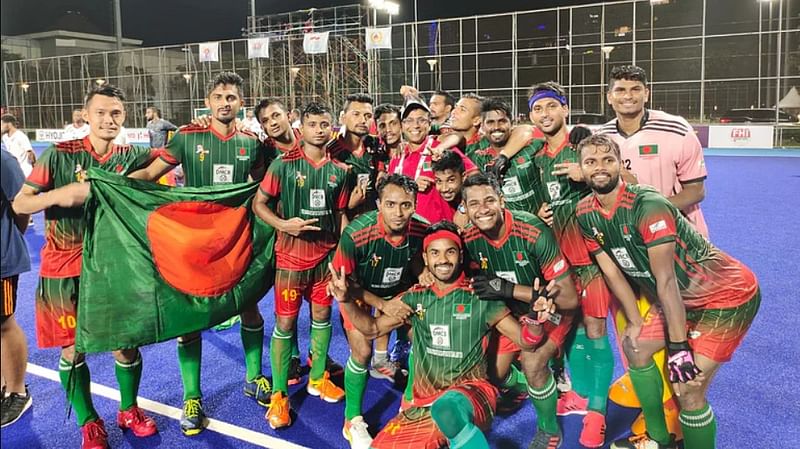 Players of Bangladesh national hockey team celebrates after winning the AHF Cup title at GBK Hockey Field in Jakarta on 20 March, 2022