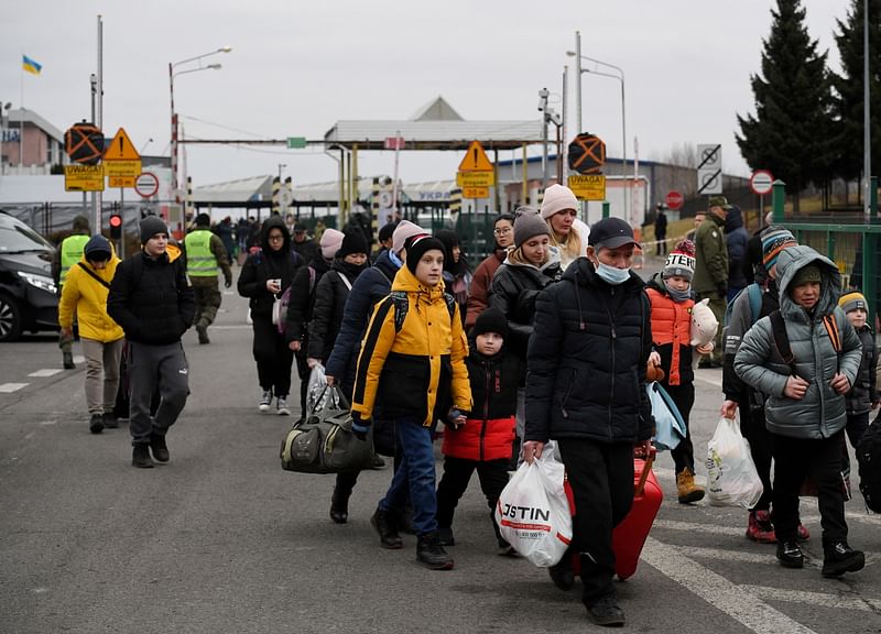 People coming from Ukraine, amid Russia's invasion of Ukraine, cross the Ukrainian-Polish border, in Korczowa, Poland on 5 March, 2022.