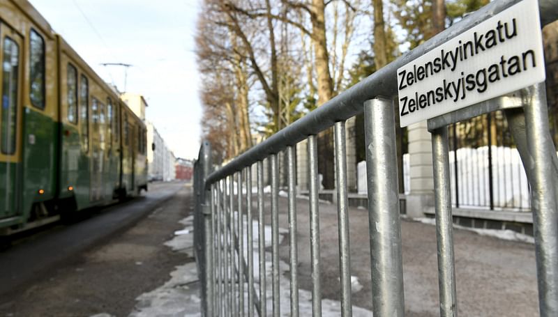 A tram passes by a streetsign 'Zelenskyinkatu' (Zelenskyi Street) by the Russian Embassy in Helsinki, Finland on 13 March 2022.