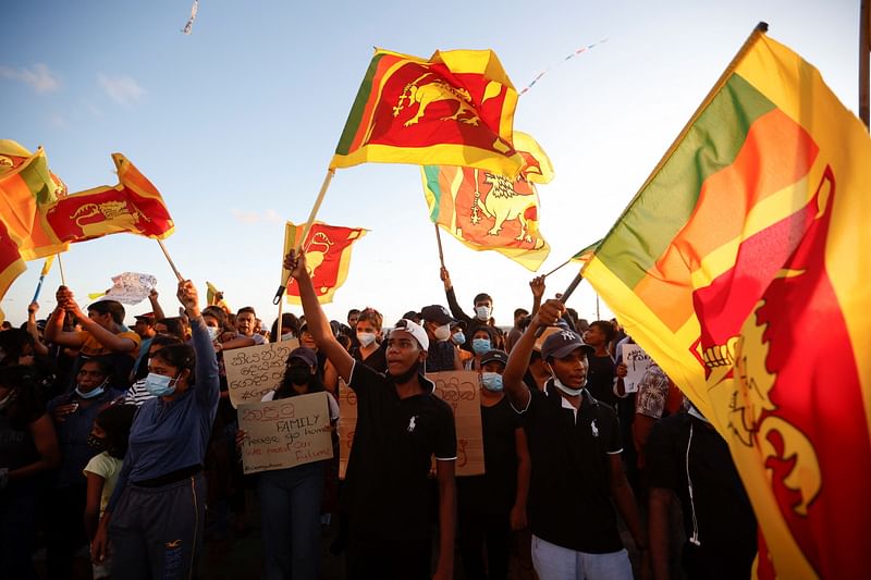 Demonstrators hold Sri Lankan national flags and shout slogans during a protest against Sri Lankan President Gotabaya Rajapaksa, near the Presidential Secretariat, amid the country's economic crisis, in Colombo, Sri Lanka, on 16 April 2022