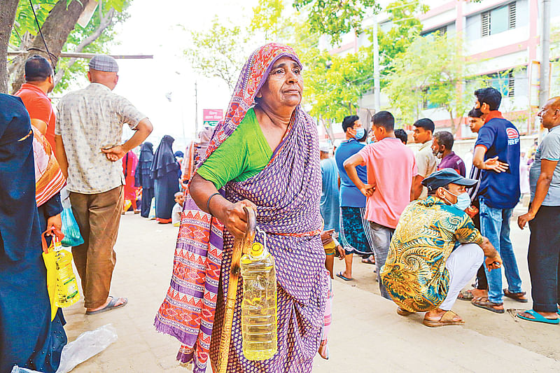 Sexagenarian Rahima Khatun purchases TCB goods in Dhaka’s Ashkona area on 3 April 2022.