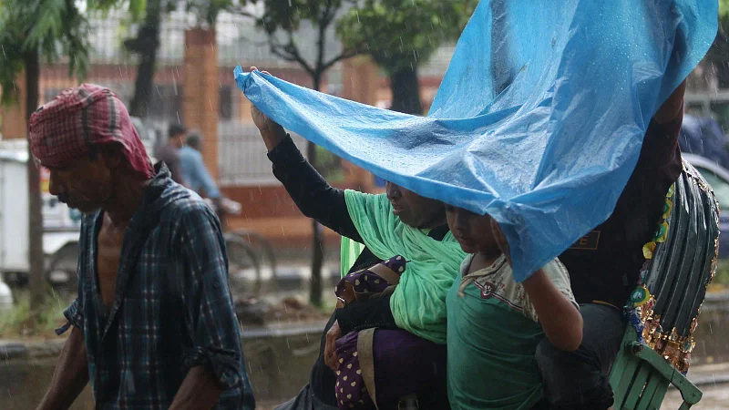 People going Eid-shopping  drenched in the rain