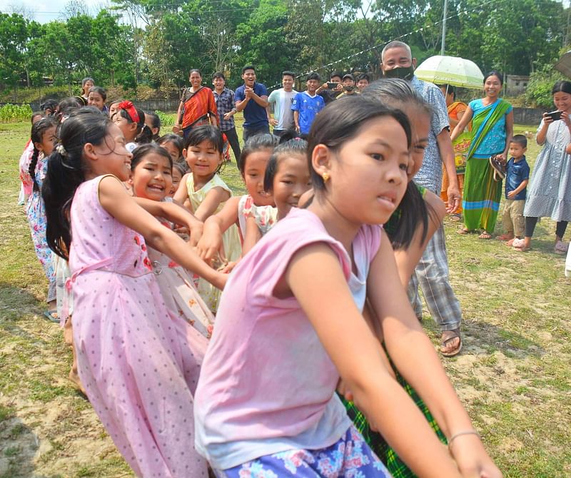 Children, from Chakma community, take part in a competition near the horticulture center in Khagrachhari