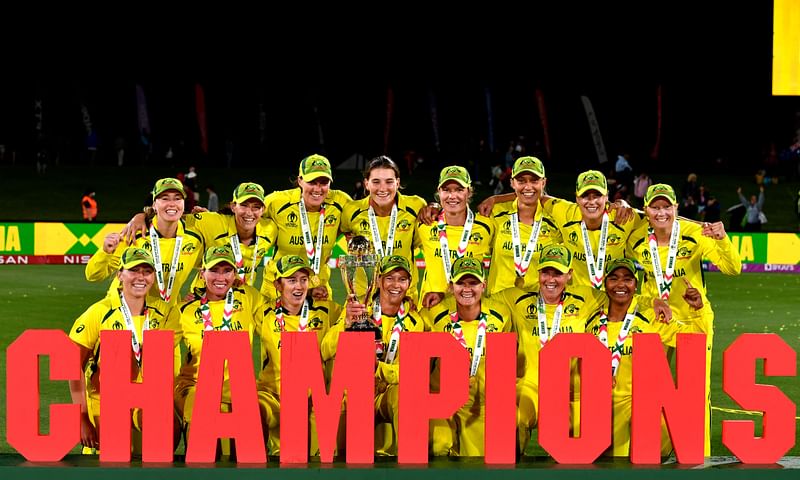 Australian team celebrate their victory with the trophy after the 2022 Women's Cricket World Cup final match between England and Australia at the Hagley Park Oval in Christchurch on 3 April, 2022.