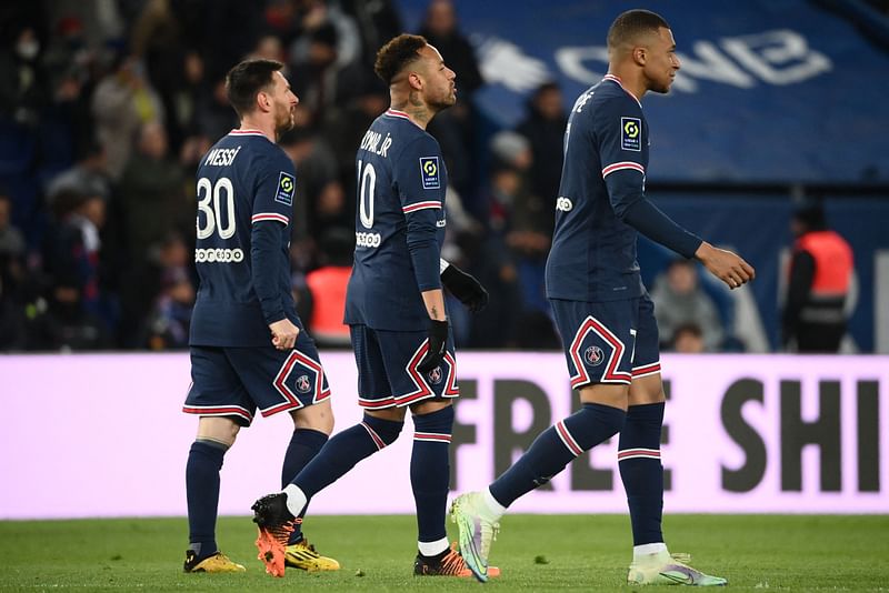 Paris Saint-Germain's Brazilian forward Neymar (C) celebrates with Paris Saint-Germain's French forward Kylian Mbappe (R) and Paris Saint-Germain's Argentinian forward Lionel Messi (L) after scoring the 5-1 goal during the French L1 football match between Paris Saint-Germain (PSG) and FC Lorient at the Parc des Princes stadium in Paris on 3 April, 2022