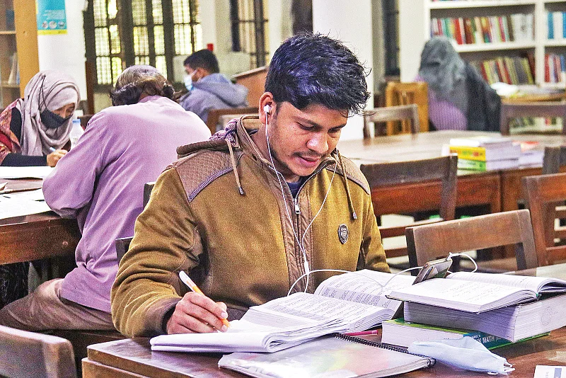 A student studies at a library in Khulna