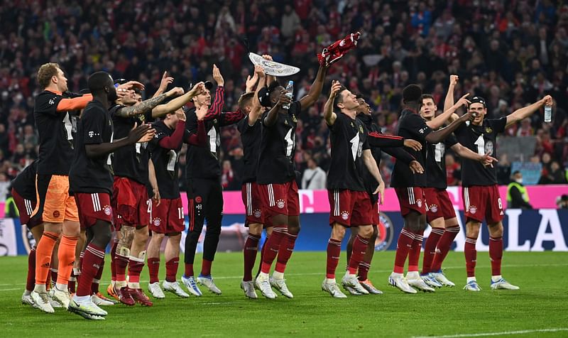 Bayern Munich players celebrate after the German first division Bundesliga football match FC Bayern Munich v BVB Borussia Dortmund in Munich, southern Germany on 23 April, 2022