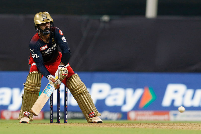 Royal Challengers Bangalore's Dinesh Karthik hits a shot during the IPL 2022 match against Delhi Capitals, at Wankhede Stadium, in Mumbai on 16 April, 2022