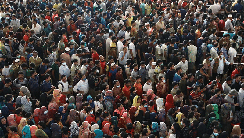 People standing in queues for train tickets at the Kamalapur Railway station