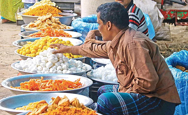 Batasha, khagrai, kadma, moor-murki, sugar animals shapes and other traditional confections being sold on Monday at the Tuntuni mela in Rajapur, Bogura