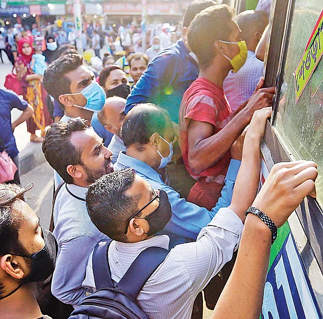 Pushing and shoving to board a bus has become an everyday affair in this city of chaotic traffic. Farmgate, 4:30pm, Monday.