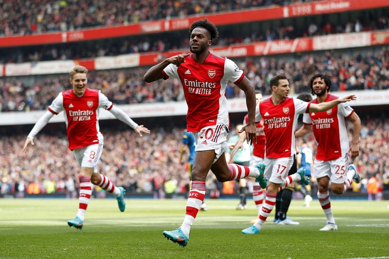 Arsenal's Portuguese defender Nuno Tavares (C) celebrates after scoring the opening goal of the English Premier League football match between Arsenal and Manchester United at the Emirates Stadium in London on 23 April, 2022