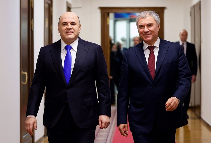 Russia's Prime Minister Mikhail Mishustin and the State Duma Speaker Vyacheslav Volodin walk before a session of the State Duma, the lower house of parliament, in Moscow, Russia 7 April, 2022