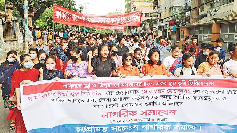 Victim Mro and Tripura community people bring out a rally in DC Hill area in Chattogram on 27 May 2022