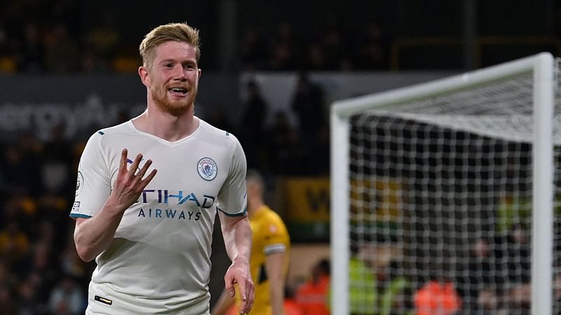 Manchester City's Belgian midfielder Kevin De Bruyne celebrates after scoring his team fourth goal during the English Premier League football match between Wolverhampton Wanderers and Manchester City at the Molineux stadium in Wolverhampton, central England on 11 May, 2022