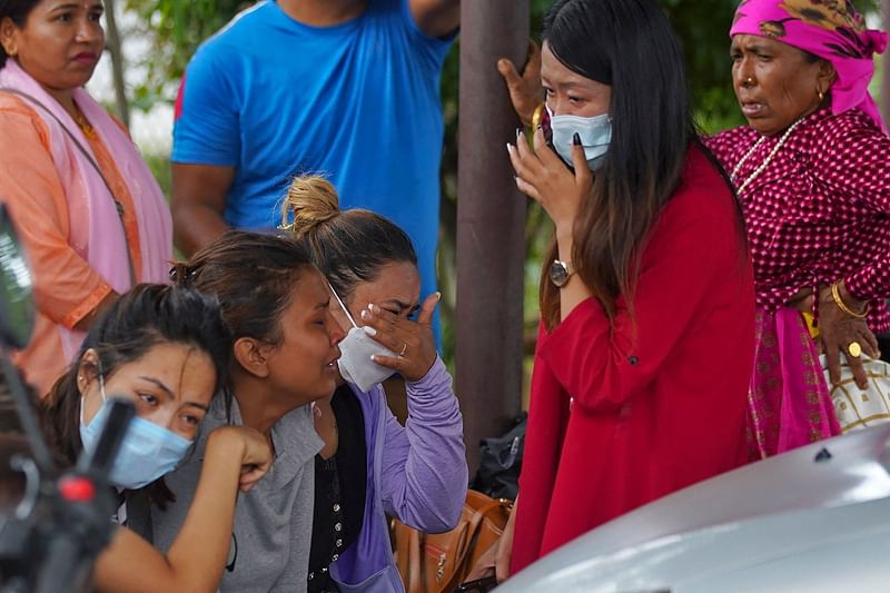 Family members and relatives of passengers on board the Twin Otter aircraft operated by Tara Air, weep outside the airport in Pokhara on 29 May, 2022