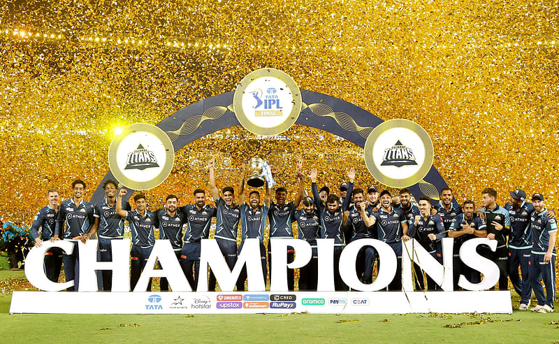 Gujarat Titans squad celebrates with the trophy after winning IPL 2022 against Rajasthan Royals, at Narendra Modi Stadium in Ahmedabad on 29 May, 2022