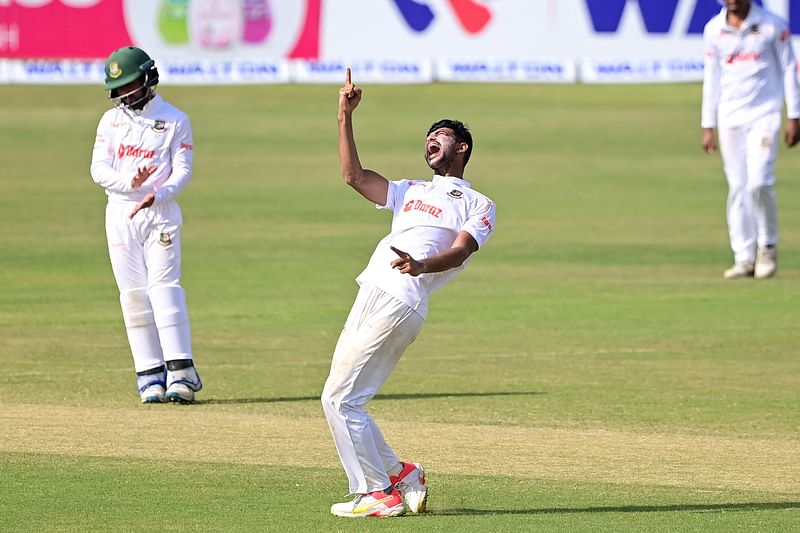 Bangladesh's Nayeem Hasan (C) celebrates with teammates after dismissing Sri Lanka's Asitha Fernando (not pictured) during the second day of the first Test cricket match between Bangladesh and Sri Lanka at the Zahur Ahmed Chowdhury Stadium in Chattogram on 16 May, 2022