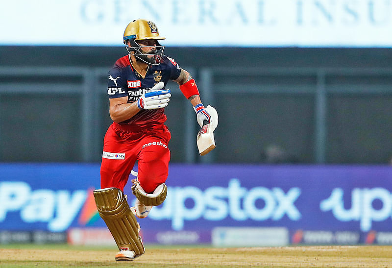 Royal Challengers Bangalore Virat Kohli running between the wicket during the Indian Premier League 2022 match between the Royal Challengers Bangalore and Gujarat Titans at the Wankhede Stadium in Mumbai on 19 May, 2022