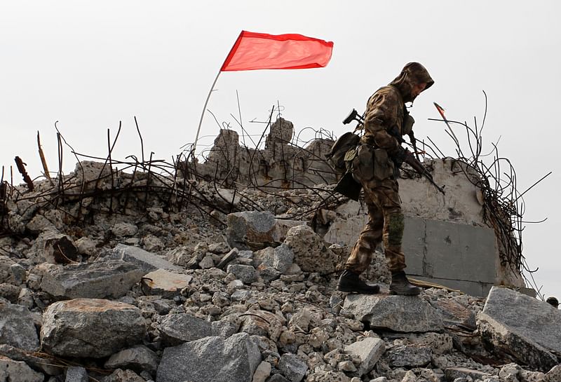 A serviceman of the self-proclaimed Donetsk People’s Republic (DNR) walks at the damaged war memorial complex Savur-Mohyla during a ceremony marking the 75th anniversary of the liberation of the Donbas region from the Nazi occupation during World War Two, outside the rebel-held city of Donetsk, Ukraine on 7 September, 2018