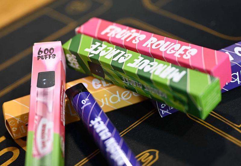 A picture shows boxes of "puffs" disposable electronic cigarettes displayed on table at La Vapotitheque store in Bethune, northern France, on 25 May, 2022.