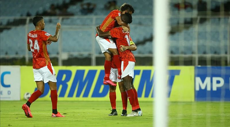 Bashundhara Kings’ striker Nuha Marong Krubally celebrates with teammates after scoring a goal during an AFC Asia Cup match against Maziya Sports and Recreation Club at the Vivekananda Yuba Bharati Krirangan in Kolkata on 18 May, 2022