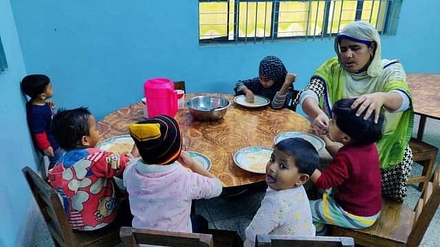 Children are having their meal at a daycare centre in Kushtia