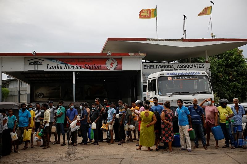 People wait in a queue to buy petrol at a fuel station, amid the country's economic crisis in Colombo, Sri Lanka, 16 May, 2022.