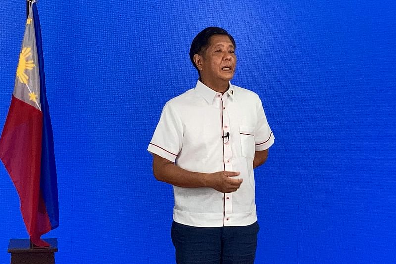 In this photo taken 9 May, 2022, Presidential candidate Ferdinand Marcos Jr., son of the late dictator Ferdinand Marcos Sr., speaks to the members of the media, at his party heaquarters in Manila