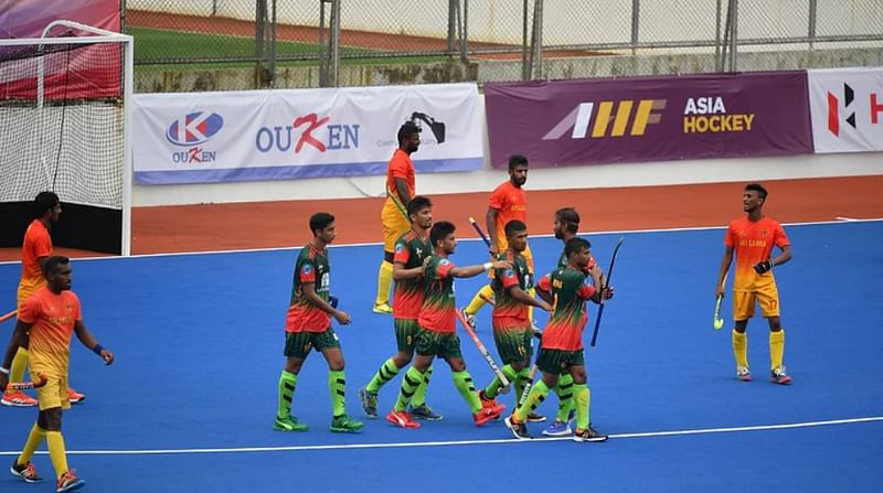 Bangladeshi players celebrate after scoring a goal during their second Pool B match against Sri Lanka on 10 May, 2022