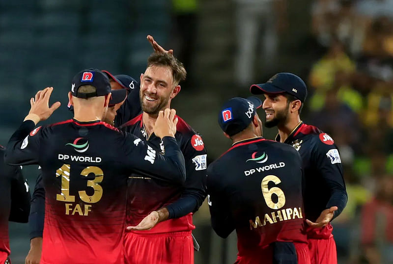 Royal Challengers Bangalore Glenn Maxwell celebrates the dismissal of Chennai Super Kings Robin Uthappa during the Indian Premier League 2022 match between Royal Challengers Bangalore and Chennai Super Kings, at Maharashtra Cricket Association Stadium in Pune on 4 May, 2022