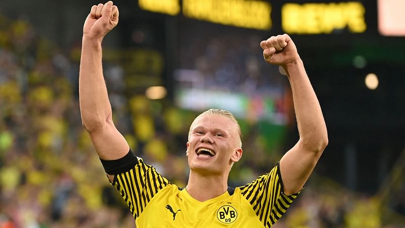 In this file photo taken on 14 August, 2021 Dortmund's Norwegian forward Erling Braut Haaland acknowledges the fans after a German first division Bundesliga football match against Eintracht Frankfurt in Dortmund