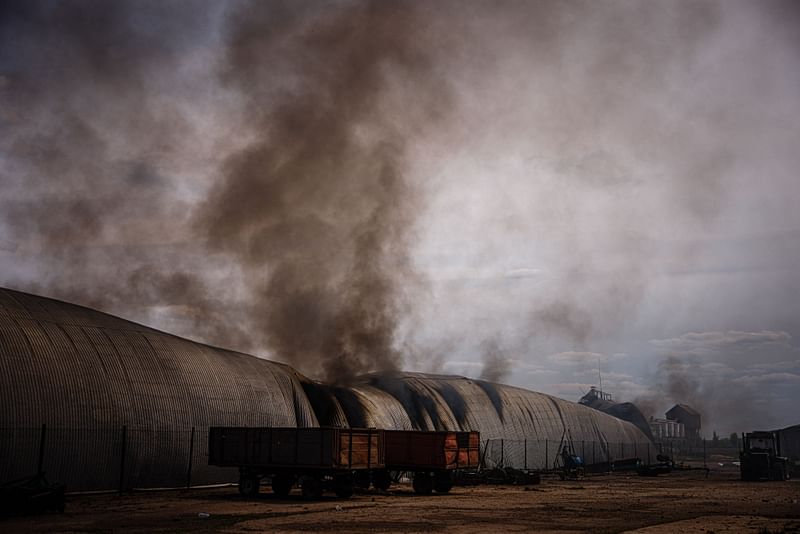 Smoke billows from a burning storage building after having been shelled in the village of Temyrivka on 4 May, 2022