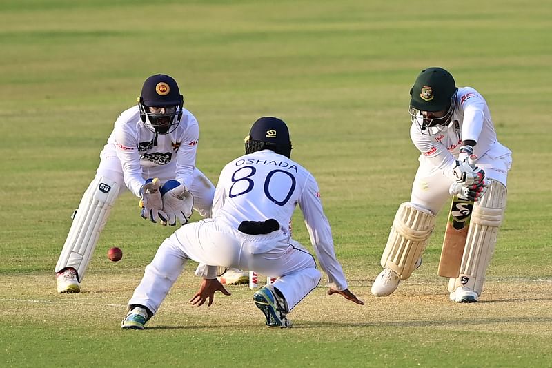 Bangladesh's Liton Das (R) plays a shot during the third day of the first Test cricket match between Bangladesh and Sri Lanka at the Zahur Ahmed Chowdhury Stadium in Chittagong on 17 May, 2022