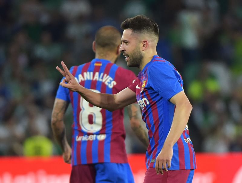 Barcelona's Spanish defender Jordi Alba celebrates after scoring a goal during the Spanish League football between Real Betis and FC Barcelona at the Benito Villamarin stadium in Seville on 7 May, 2022.