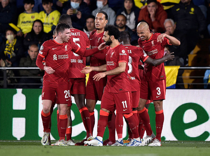 Liverpool’s Sadio Mane celebrates scoring their third goal with Mohamed Salah, Andrew Robertson and teammates in the Second Leg of Champions League Semi-final against Villarreal at Estadio de la Ceramica, Villarreal, Spain on 3 May 2022