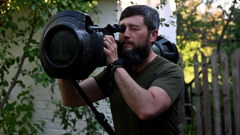 A Ukrainian serviceman checks a just received Next Generation Light Anti-Armour Weapon (NLAW) on the position not far from the Ukrainian town of Chuguiv, in Kharkiv region on 9 June 2022