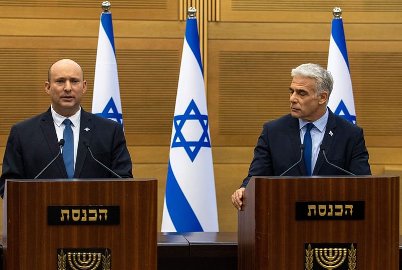 Israel's Prime Minister Naftali Bennett (L) and Foreign Minister Yair Lapid make a joint statement to the press in Jerusalem on 20 June, 2022