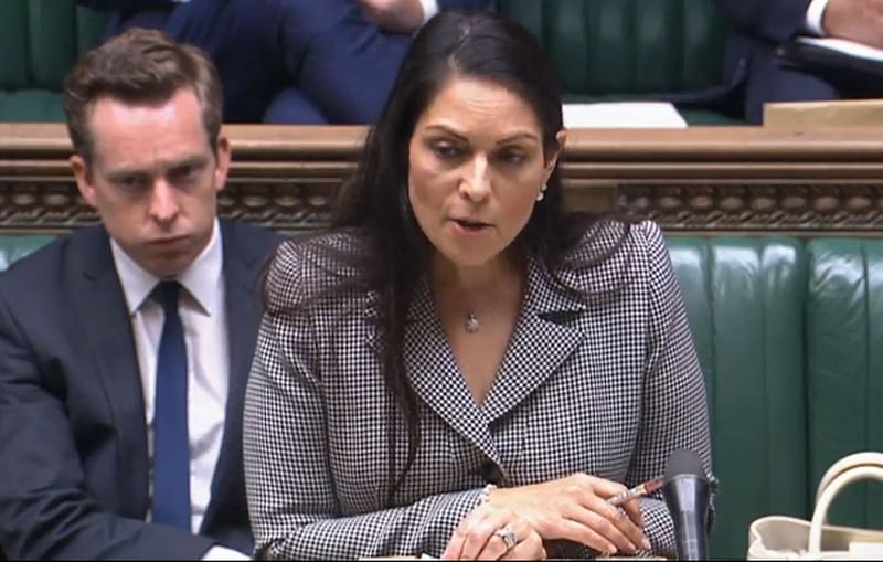 A video grab from footage broadcast by the UK Parliament's Parliamentary Recording Unit (PRU) shows Britain's Home Secretary Priti Patel gesturing as she gives a statement concerning the government's plan to send migrants and asylum seekers who cross the Channel to Rwanda, in the House of Commons, in London, on 15 June, 2022