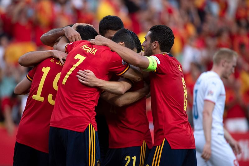 Spain's players celebrate their opening goal scored by midfielder Carlos Soler during the UEFA Nations League, league A group 2 football match between Spain and Czech Republic at at La Rosaleda stadium in Malaga on 12 June, 2022