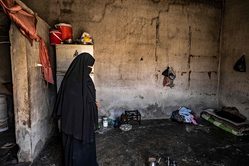 Nora, 31, a former detainee at the Kurdish-run al-Hol camp where relatives of suspected Islamic State (IS) group fighters were held, gives an interview at her home in Syria's northern city of Raqa on 4 June, 2022