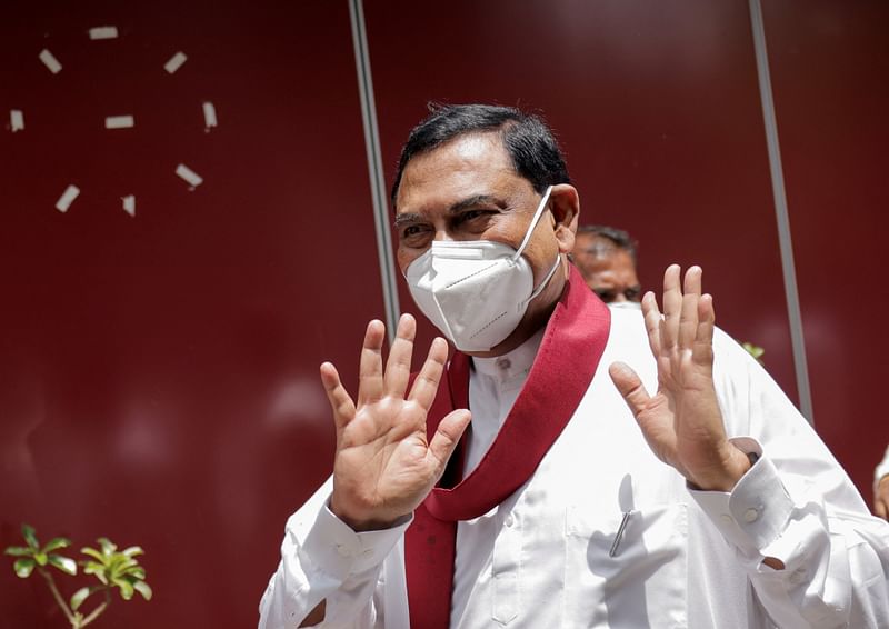 Basil Rajapaksa, one of the brothers of Sri Lanka's president Gotabaya Rajapaksa, gestures as he leaves after he announced that he had resigned from parliament, amid the country's economic crisis, in Colombo, Sri Lanka, 9 June, 2022