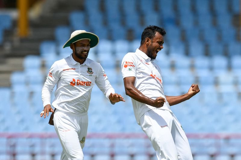 Shoriful Islam (R) and Najmul Hossain Shanto (L), of Bangladesh, celebrate the dismissal of John Campbell, of West Indies, during the second day of the 2nd Test between Bangladesh and West Indies at Darren Sammy Cricket Ground in Gros Islet, Saint Lucia on 25 June, 2022